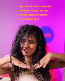Silky, moisturized curly hair showcasing hydration, softness, and natural shine with long-lasting hold, ideal for enhancing natural texture and protecting against humidity.