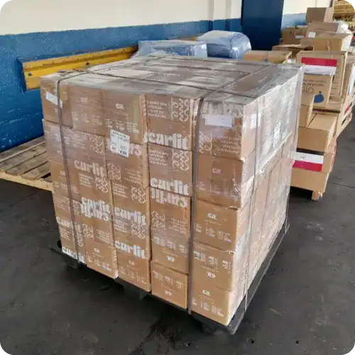 Shipping pallet with curled hair products in boxes for professional salon use, ready for distribution and retail, packaging for Curlit hair care products, bulk shipment, cosmetology supplies, hair treatment essentials.